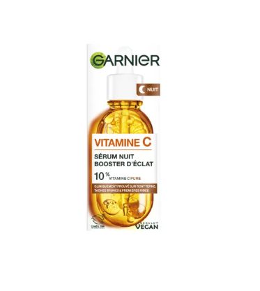 Sérum visage Garnier Skin Active Nuit Booster d'Éclat à la vitamine C pure, anti-taches et rides, flacon avec pipette.