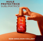 Lait solaire Garnier Ambre Solaire SPF 15 pour protection moyenne, flacon blanc avec étiquette colorée, vue de face.