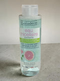 Lotion nettoyante Evoluderm à l'eau, 500 ml, pour peaux sèches et sensibles, avec une bouteille et le flacon visible.